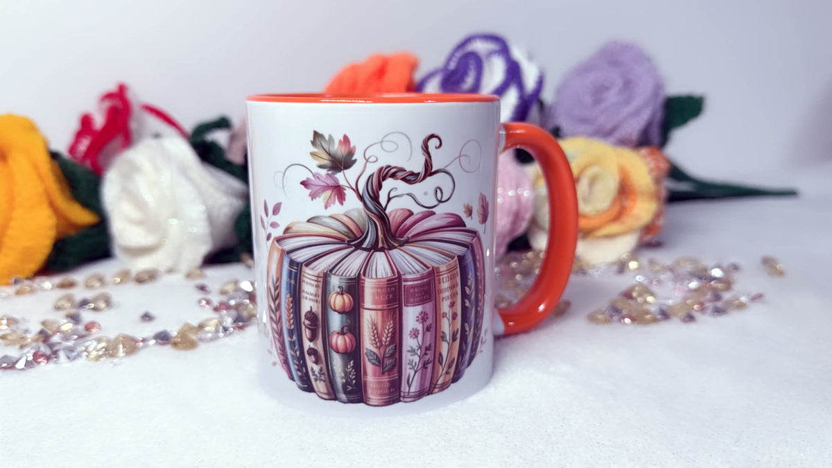 Autumn book lover mug with book pumpkin design and orange handle