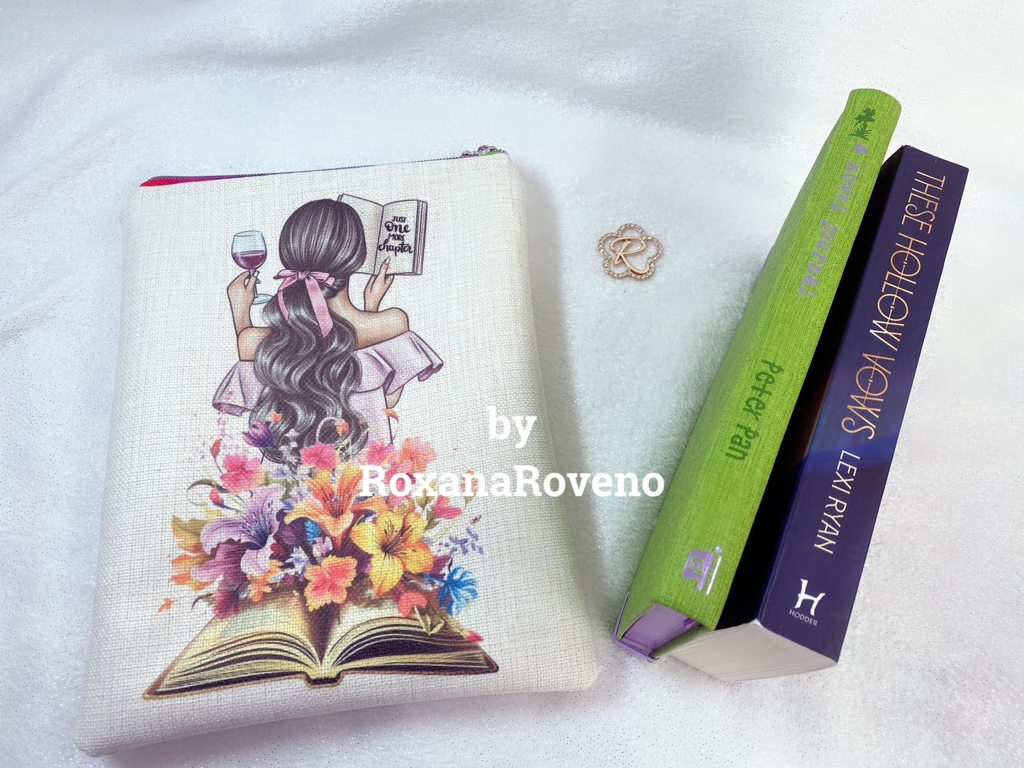 handmade book sleeve designed by Roxana Roveno Woman reading between flowers and stack of books and text 'just a girl who loes books' perfect protection for your book fit perfect two small size books