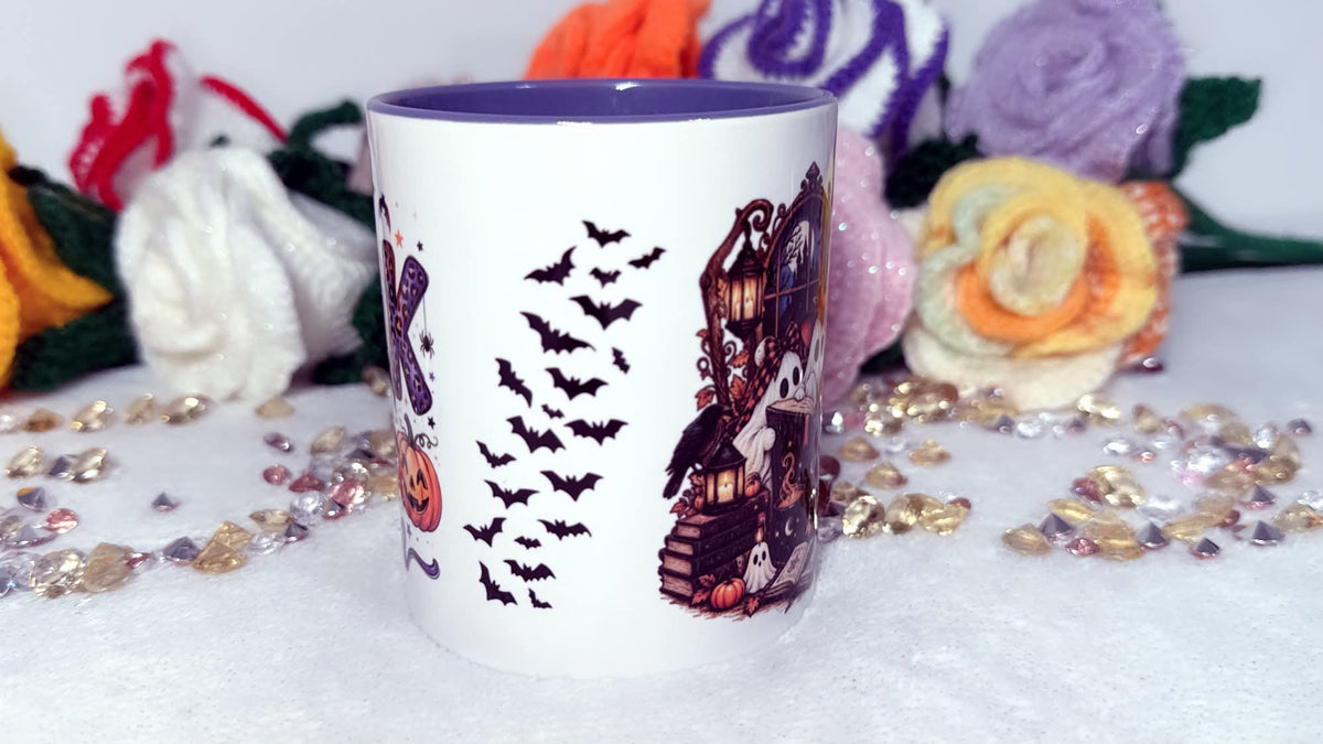 Halloween book lover mug with bats ghosts books and autumn spooky design