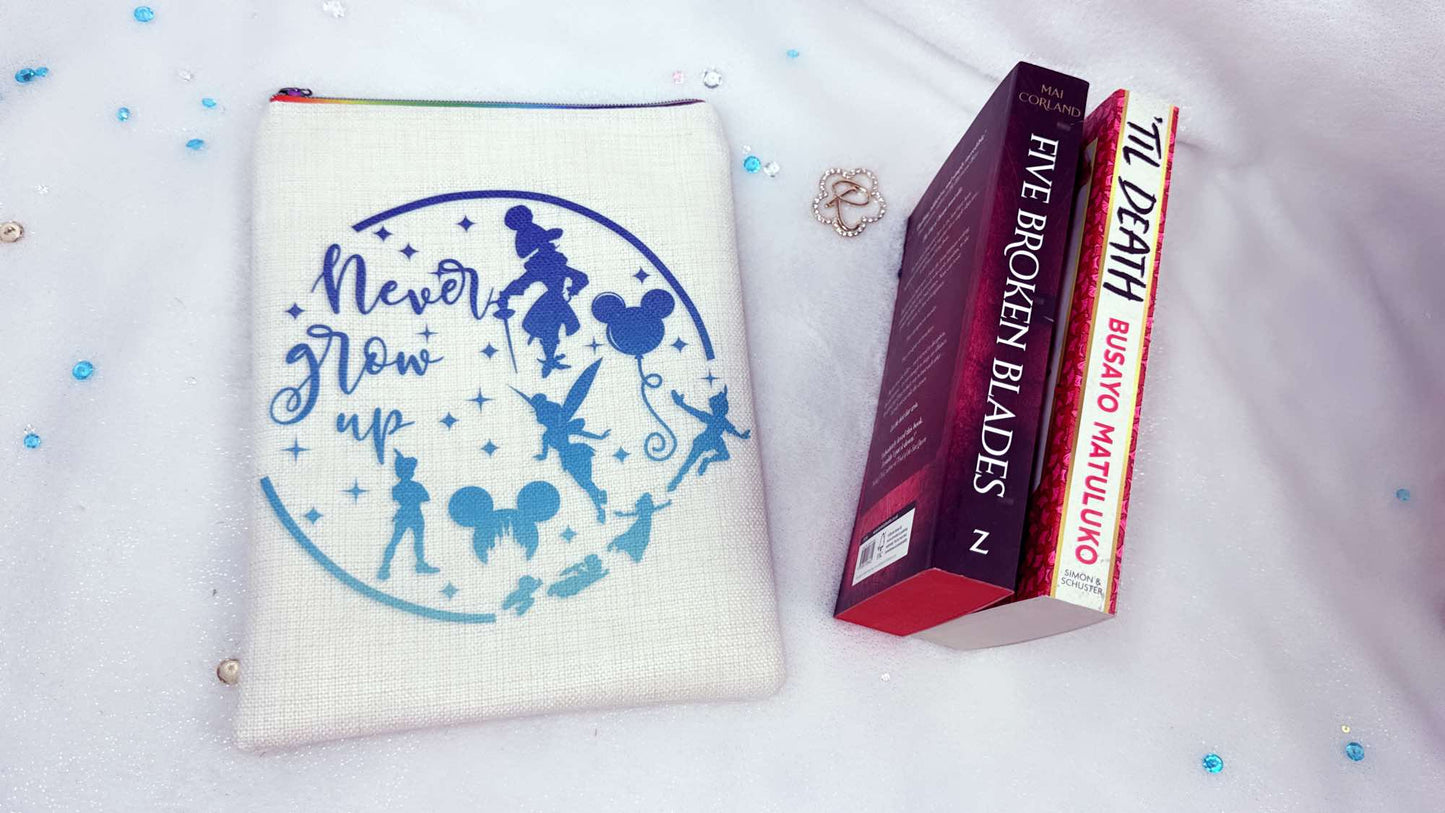 Personalised book sleeve handmade by Roxana Roveno with a special design inspired by classic stories Peter Pan  back side with quote 'never grow up' 