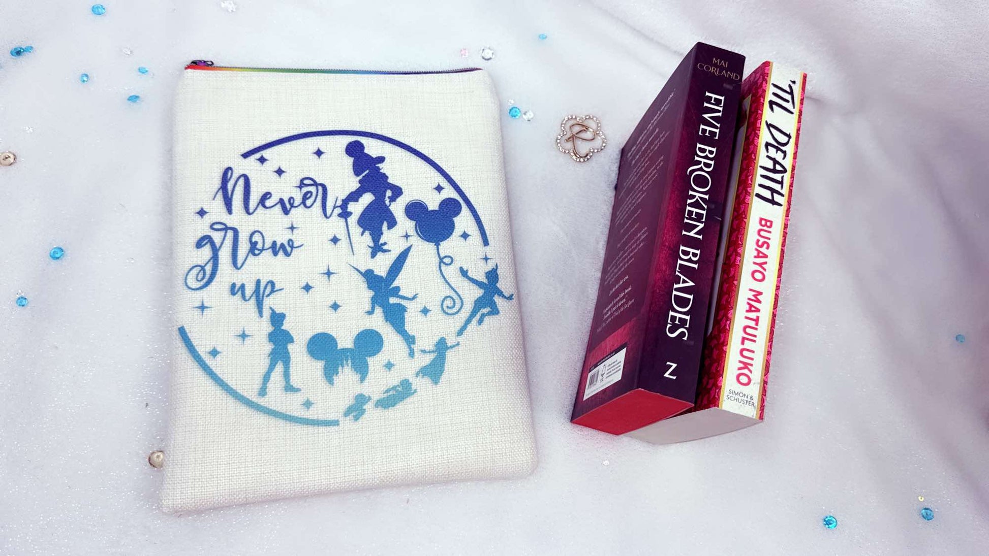 Personalised book sleeve handmade by Roxana Roveno with a special design inspired by classic stories Peter Pan  back side with quote 'never grow up' 