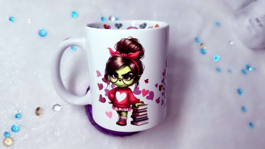 personalised mug by Roxana Roveno With a green girl holding a stack of books best gift for her best gift for Valentines Day