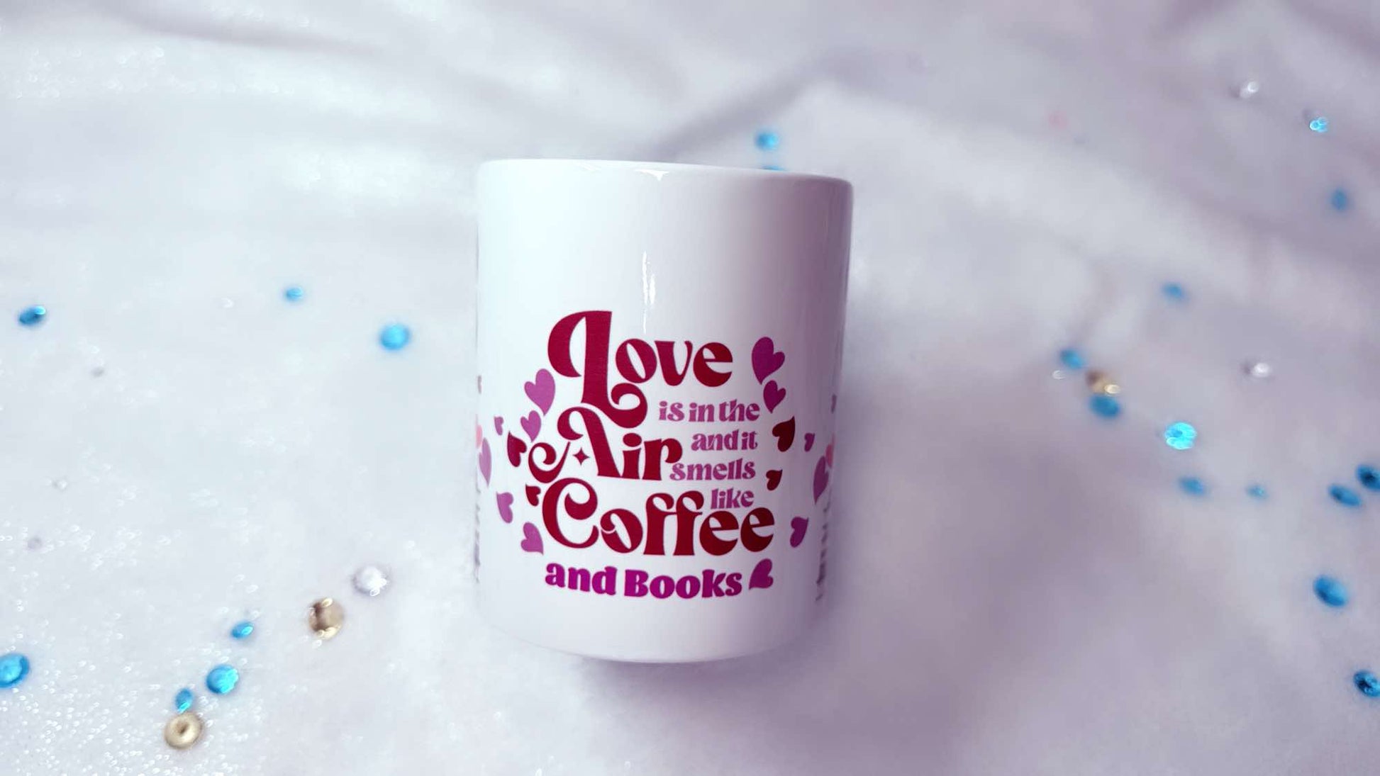 personalised mug by Roxana Roveno with love quote 'love is in the air and smells like coffee and books'