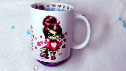 personalised mug by Roxana Roveno With a green girl holding a stack of books best gift for her best gift for Valentines Day  around hearts