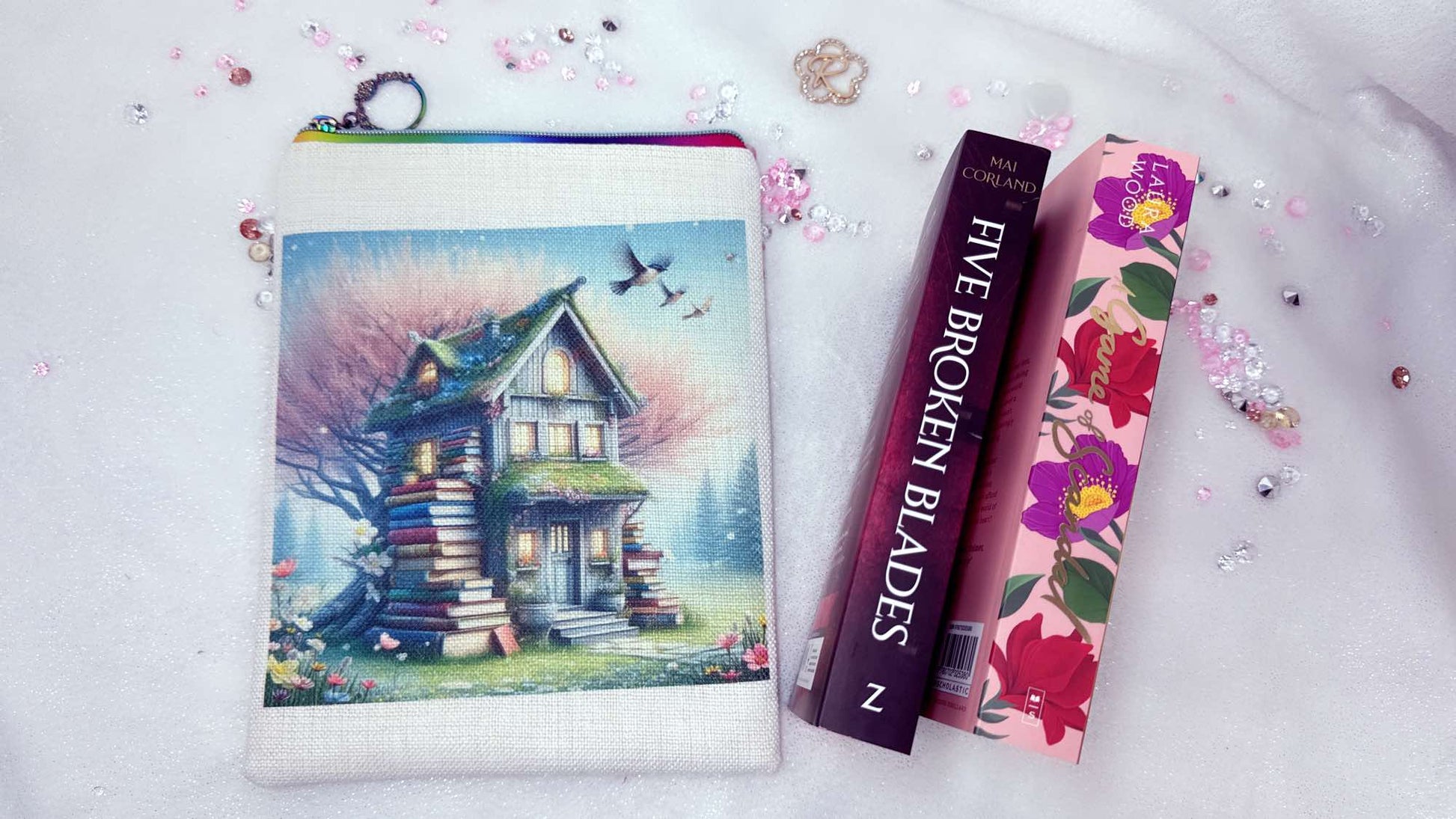 Personalised book sleeve by Roxana Roveno designed with a house of books in a spring background special gift for a book lover perfect fit for books like 'five broken blades' and 'a game of scandal' perfect gift for Woman's day and Mother's day
