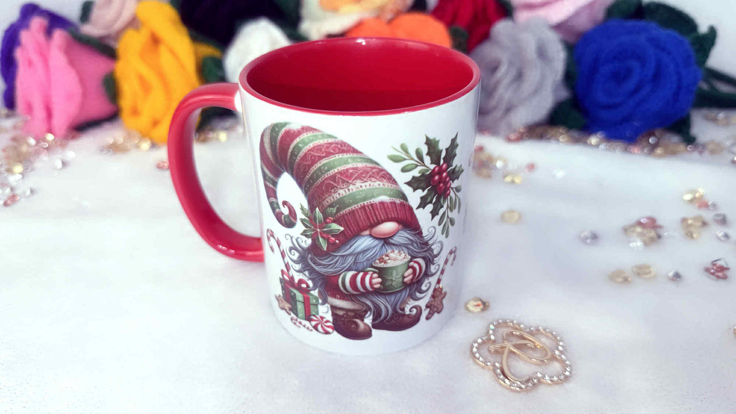 Mug with a gnome design on a decorative surface with flowers and jewelry.