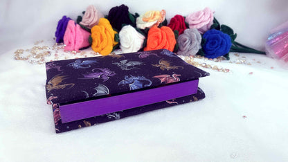 back book cover with colorful dragon pattern on a white surface