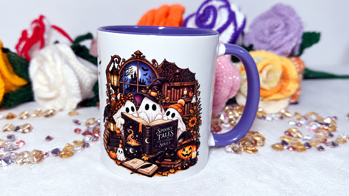 Spooky Tales Halloween mug with ghosts books pumpkins and purple handle