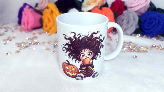 White mug with Halloween-themed design featuring a child in a striped outfit and pumpkin, surrounded by colorful flowers.